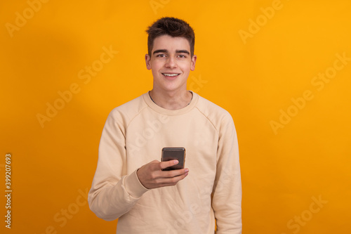teenager boy with mobile phone isolated