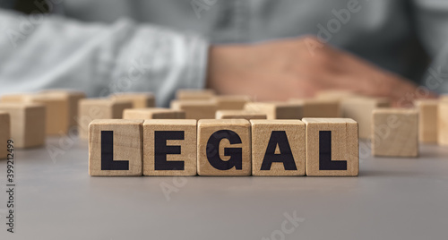 The word LEGAL made from wooden cubes. Shallow depth of field on the cubes