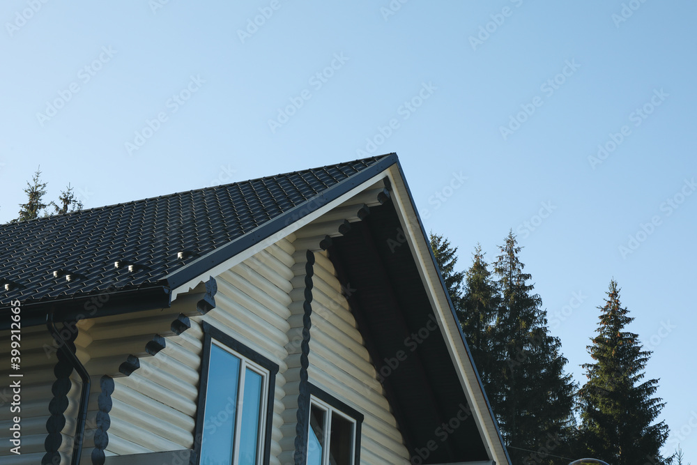 Beautiful white wooden house against clear blue sky Beautiful white wooden house against clear blue sky