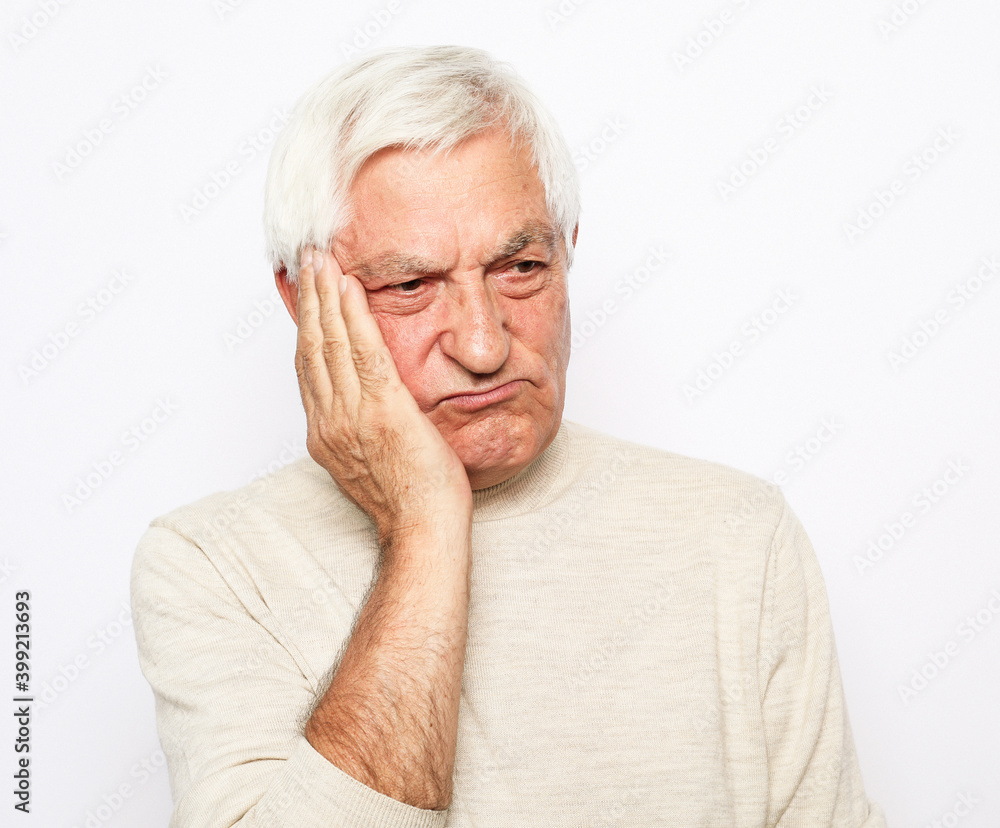 lifestyle, health and people concept: Senior man has headache, on white background lifestyle, health and people concept: Senior man has headache, on white background