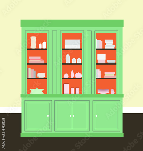 Green sideboard with dishes, candles, books, boxes, cups