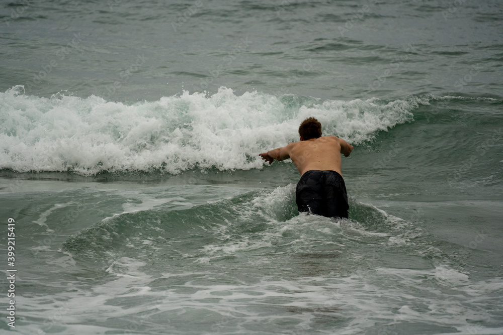 Early morning swimmers heading out at the famous Coogee Beach for an early morning swim Early morning swimmers heading out at the famous Coogee Beach for an early morning swim
