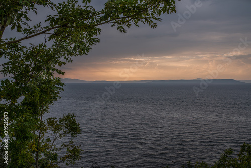 Beautiful sunset with clouds and sea. © Vladimir Arndt