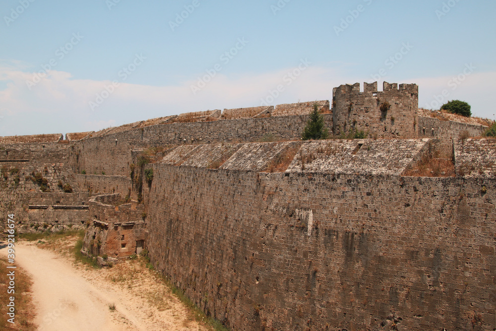Rhodes fortifications, fortress wall with a carved coat of arms, medieval fortress, the old town of Rhodes, Greece Rhodes fortifications, fortress wall with a carved coat of arms, medieval fortress, the old town of Rhodes, Greece