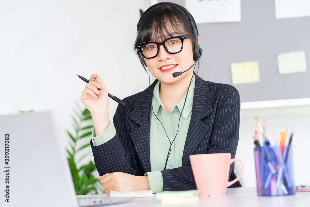 Asian woman is meeting online with colleagues via video call app on laptop Asian woman is meeting online with colleagues via video call app on laptop