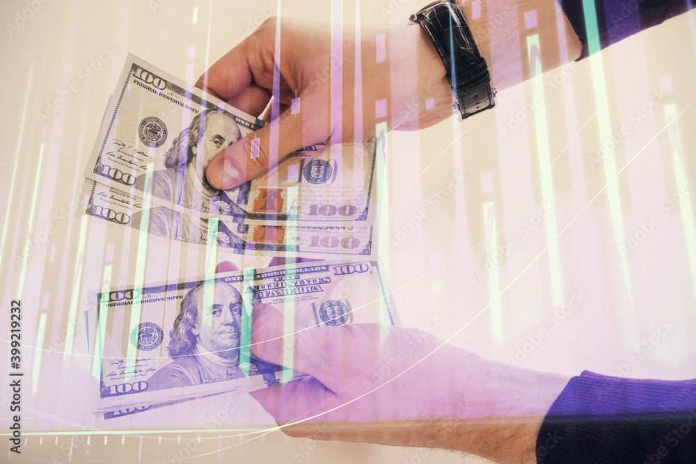 Multi exposure of financial graph drawing hologram and USA dollars bills and man hands. Analysis concept. Multi exposure of financial graph drawing hologram and USA dollars bills and man hands. Analysis concept.