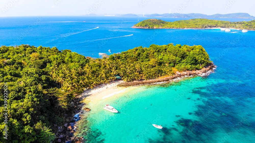Aerial view of beautiful landscape, tourism boats, and people swimming on the sea and beach on May Rut island (a tranquil island with beautiful beach) in Phu Quoc, Kien Giang, Vietnam.