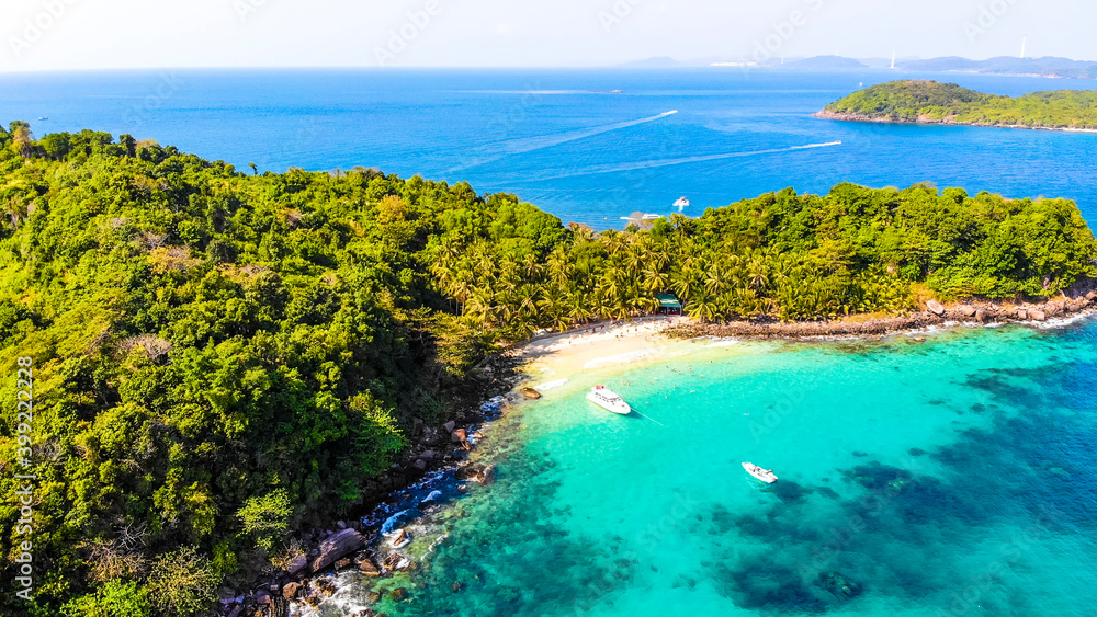Aerial view of beautiful landscape, tourism boats, and people swimming on the sea and beach on May Rut island (a tranquil island with beautiful beach) in Phu Quoc, Kien Giang, Vietnam. Aerial view of beautiful landscape, tourism boats, and people swimming on the sea and beach on May Rut island (a tranquil island with beautiful beach) in Phu Quoc, Kien Giang, Vietnam.