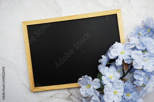 Mock-up flat lay Black board and flower bouquet decoration