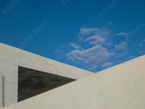 Blue sky with white cement wall and copy space for text or image.
