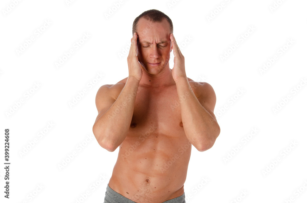 Fototapeta premium Stress and headache for an attractive young guy.