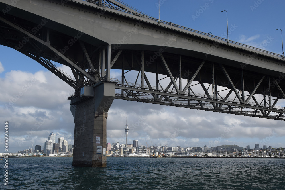 Fototapeta premium Auckland harbour bridge crossing, with Auckland city in the background.