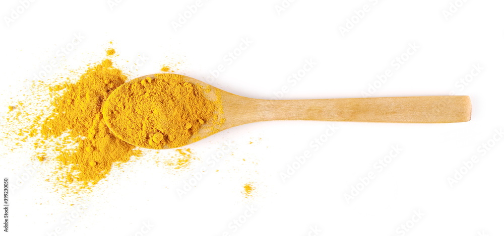 Turmeric (Curcuma) powder pile in wooden spoon isolated on white background, top view Turmeric (Curcuma) powder pile in wooden spoon isolated on white background, top view