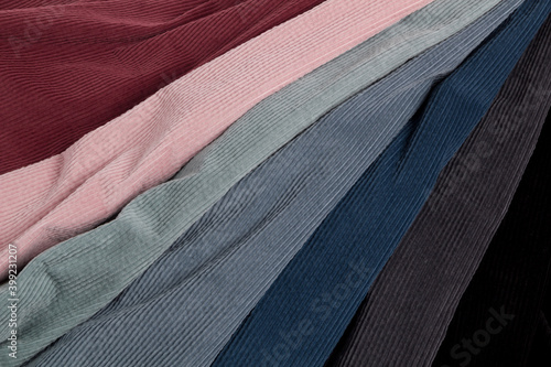 Tableau sur toile Multicolored fabrics folded in a stack