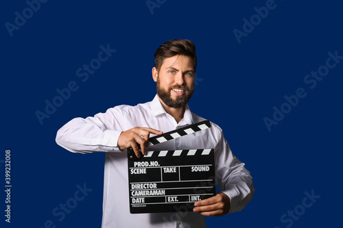 Man with movie clapper on c...