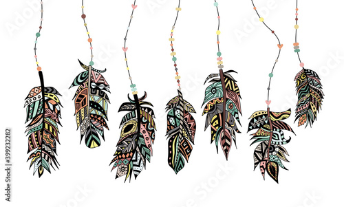 Set of beautiful colored tribal feathers with beads a vector illustration.