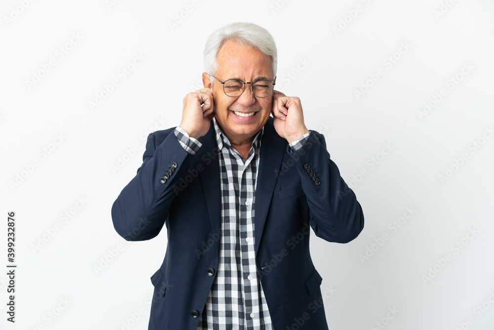 Middle age Brazilian man isolated on white background frustrated and covering ears Middle age Brazilian man isolated on white background frustrated and covering ears