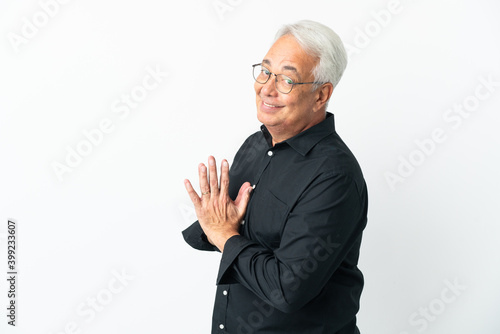 Middle age Brazilian man isolated on white background scheming something