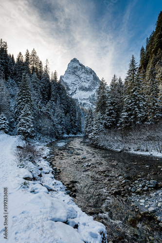 winter in Rosenlaui with Wellhorn and mountain creek Rychenbach, Switzerland photo