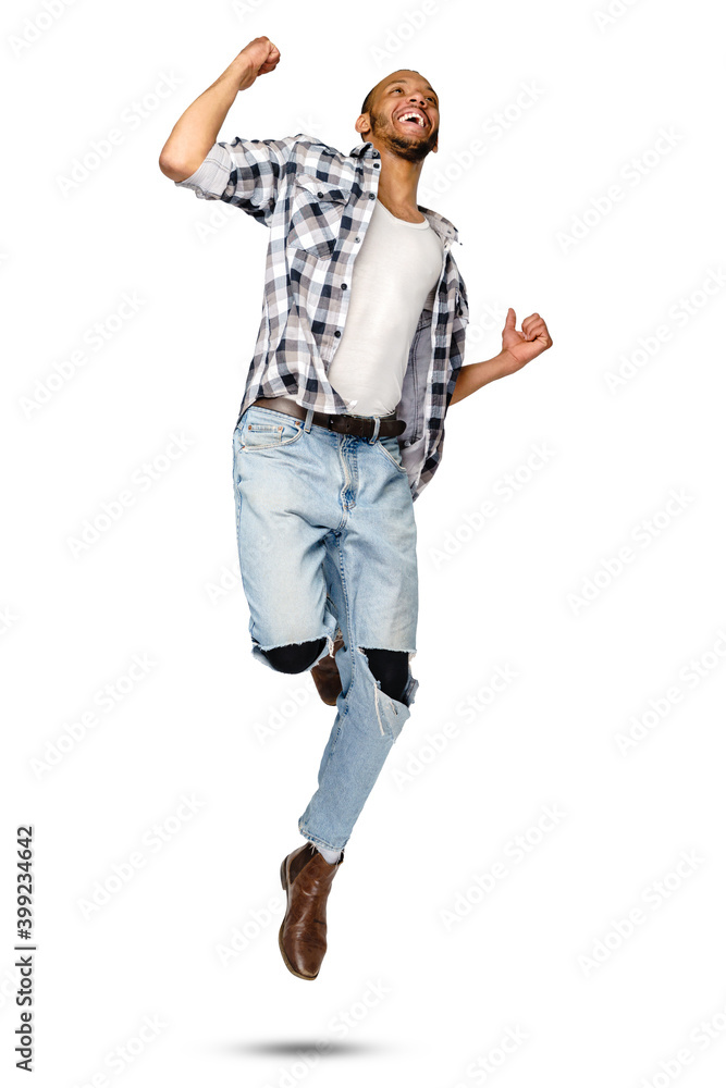 Casual african-american man jumping in studio over white background Casual african-american man jumping in studio over white background