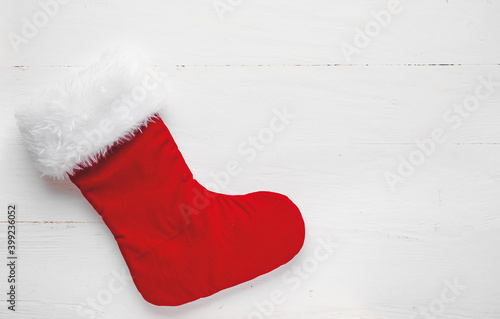 Christmas sock on white wooden background