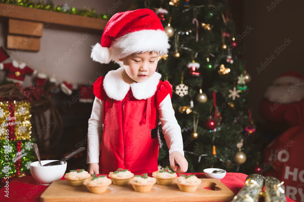 young girl preparing mince pie for celebrating Christmas party young girl preparing mince pie for celebrating Christmas party