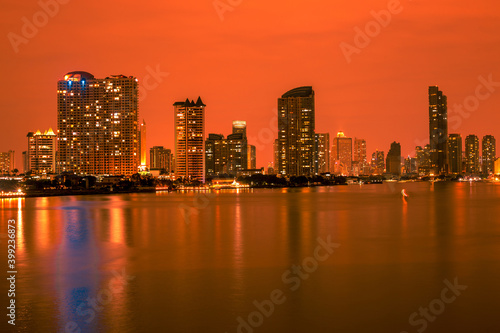 Wallpaper Mural Blurred abstract background of high-rise buildings built by the river, lit at night, the distribution of residences of today's capital so Torontodigital.ca