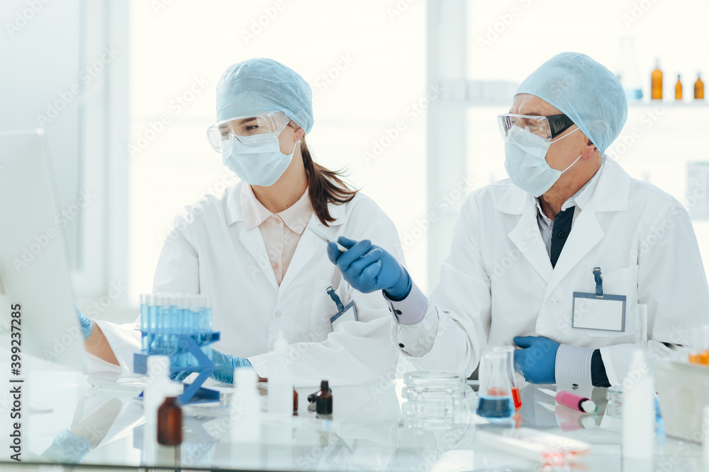 close up. scientists using a computer in a medical laboratory. close up. scientists using a computer in a medical laboratory.