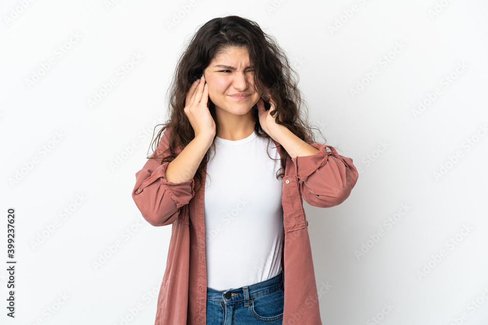 Teenager Russian girl isolated on white background frustrated and covering ears Teenager Russian girl isolated on white background frustrated and covering ears