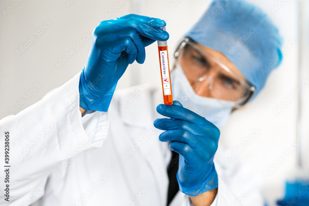 test tube in the hands of the researcher . test tube in the hands of the researcher .