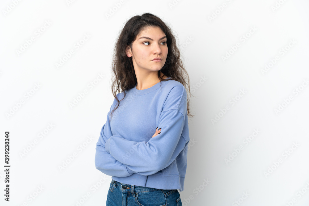 Teenager Russian girl isolated on white background keeping the arms crossed Teenager Russian girl isolated on white background keeping the arms crossed
