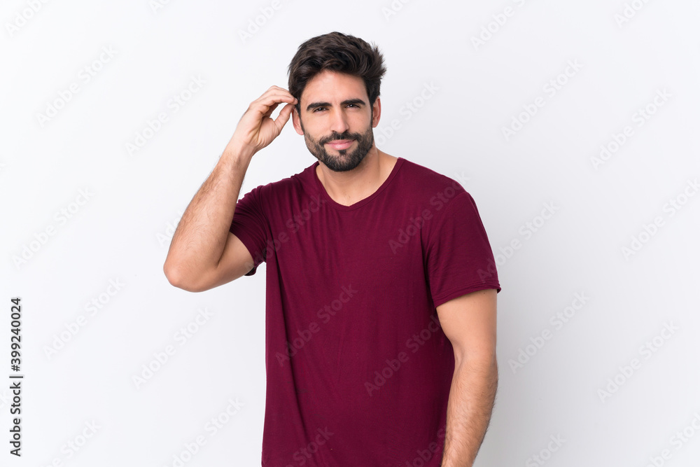 Fototapeta premium Young handsome man with beard over isolated white background having doubts