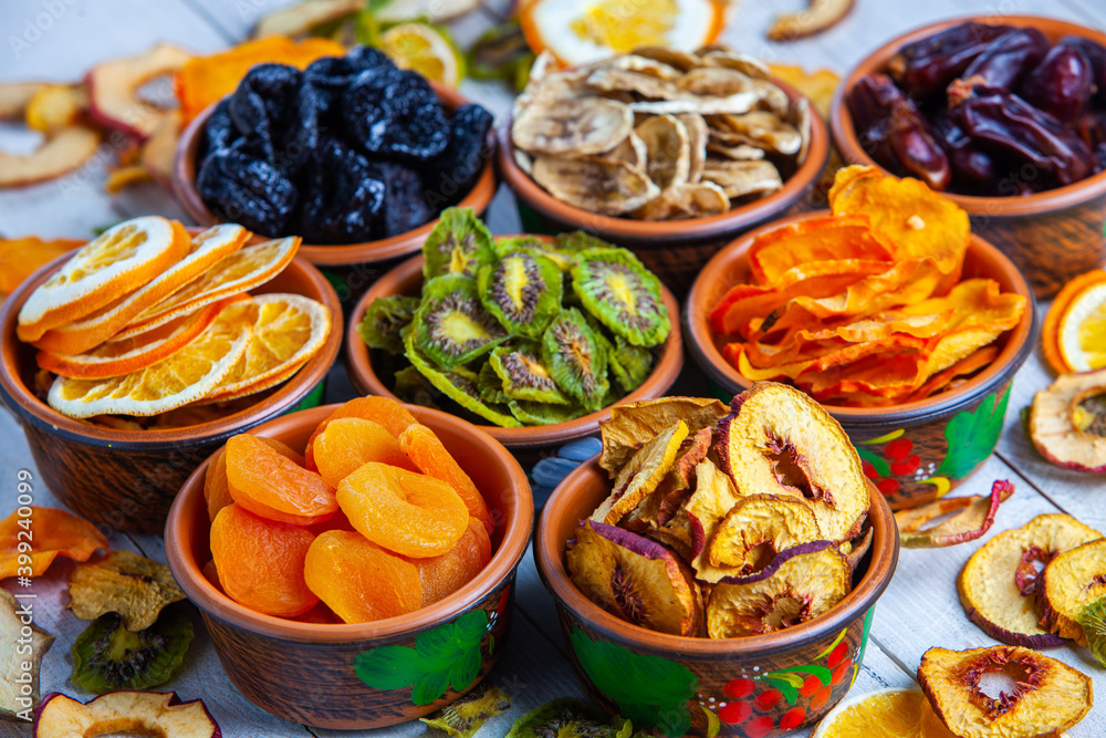 Organic Healthy Assorted Dried Fruit Mix close up. Dried fruit snacks. dried apples, mango, feijoa, dried apricots, prunes top view Organic Healthy Assorted Dried Fruit Mix close up. Dried fruit snacks. dried apples, mango, feijoa, dried apricots, prunes top view