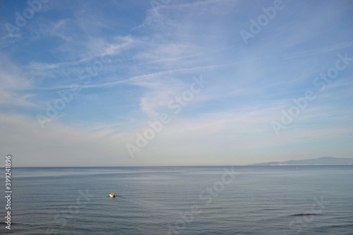 Marmara sea and blue sky together. Fisherman fishing in the sea. Mudanya, Bursa, Turkey.