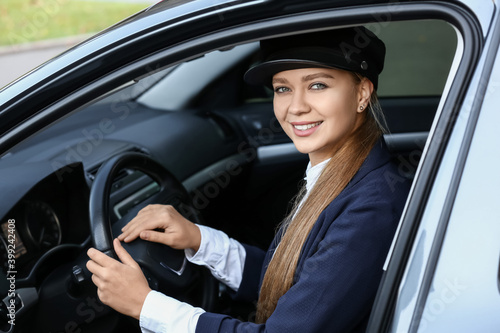 Beautiful chauffeur driving...