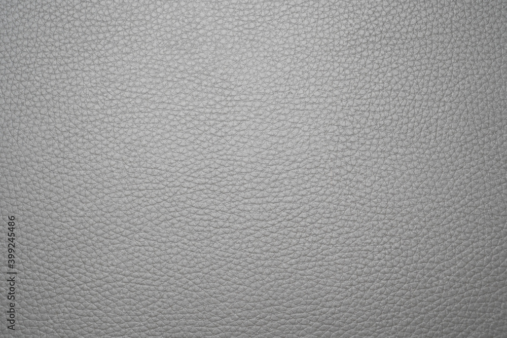 a soft-textured grey leather background consisting of lines of a constant pattern. a soft-textured grey leather background consisting of lines of a constant pattern.