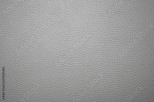 a soft-textured grey leather background consisting of lines of a constant pattern.