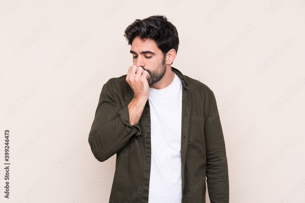 Young handsome man with beard over isolated background having doubts Young handsome man with beard over isolated background having doubts