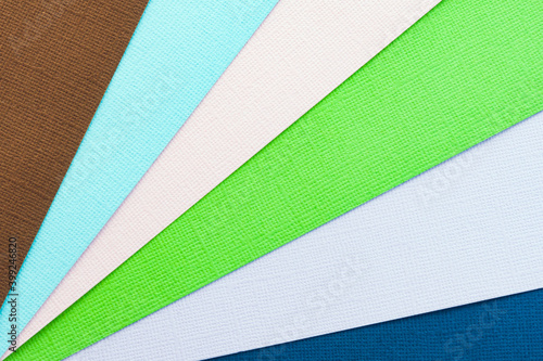 Abstract color papers geometry flat lay composition banner background with green, pink, blue color tones