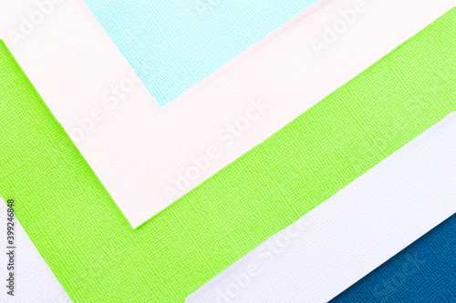 Abstract color papers geometry flat lay composition banner background with green, pink, blue color tones