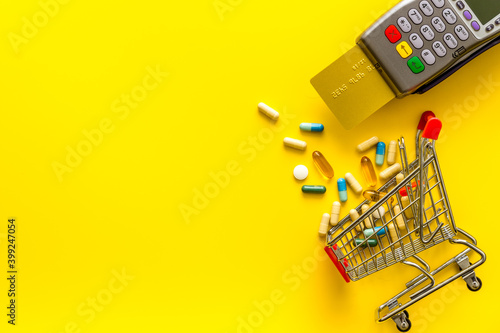 Making medicine purchases - payment terminal with a bank card, top view