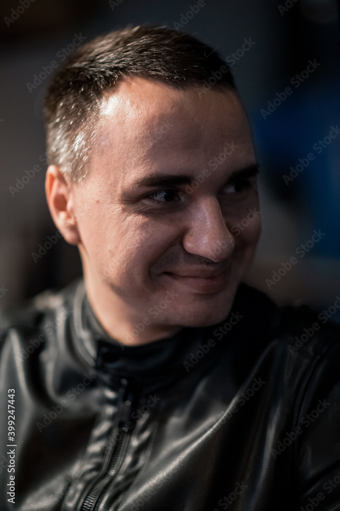 Portrait of a handsome young man. Shooting in a bar