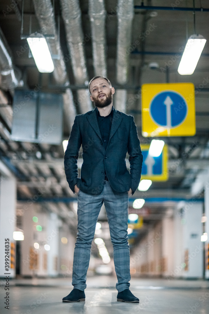 Obraz premium Portrait of a handsome young man. Shooting in a car park
