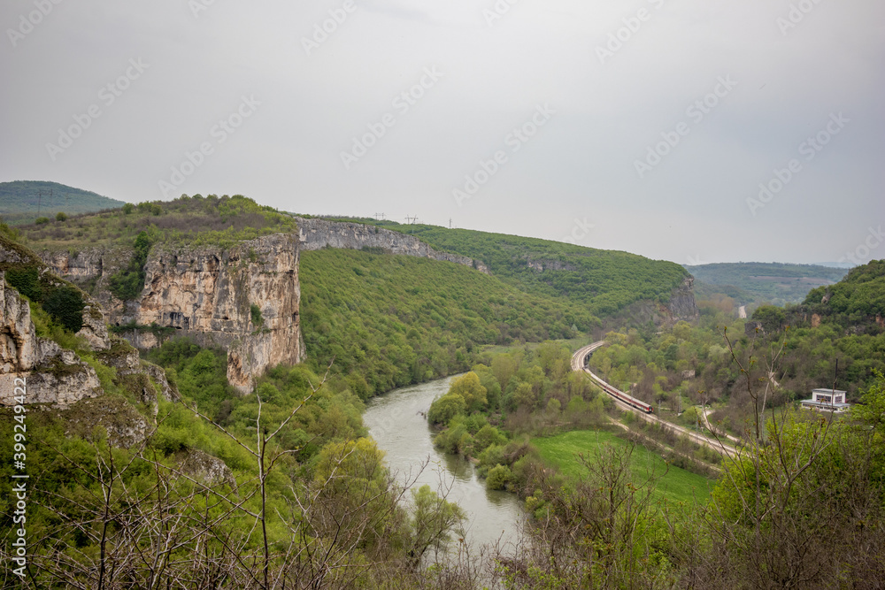 Iskar river gorge moody day landscape view from above near main entrance of Prohodna cave, Northwestern Bulgaria
