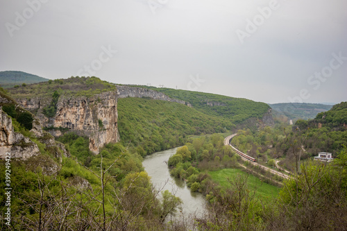 Iskar river gorge moody day landscape view from above near main entrance of Prohodna cave, Northwestern Bulgaria
