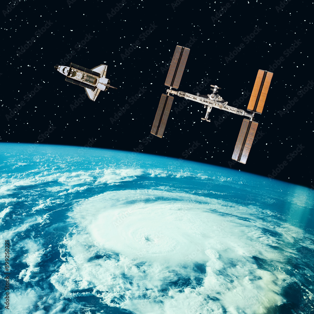 Shuttle and satellite above the earth. The elements of this image furnished by NASA. Shuttle and satellite above the earth. The elements of this image furnished by NASA.