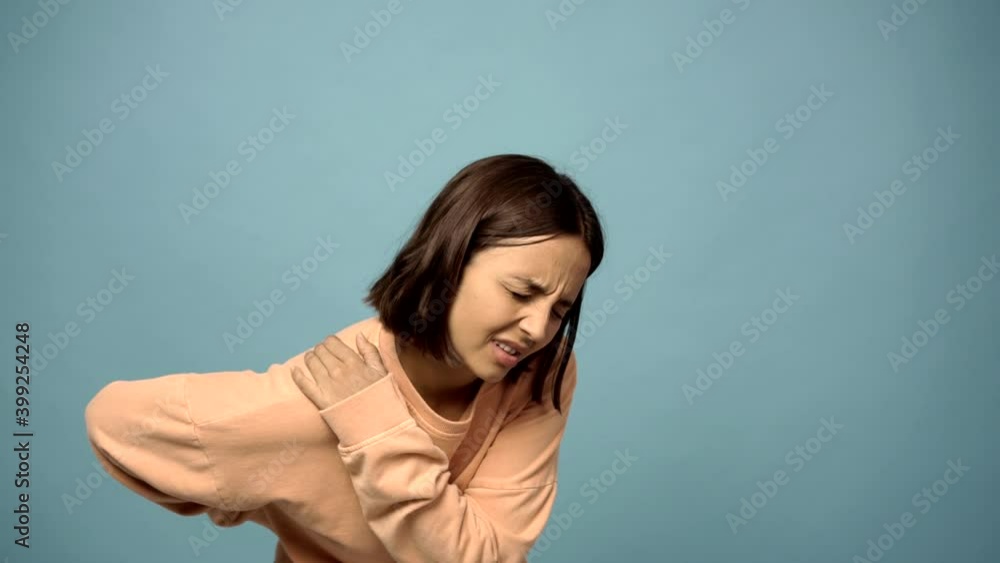 woman suffering from pain in shoulder for having made an effort woman suffering from pain in shoulder for having made an effort