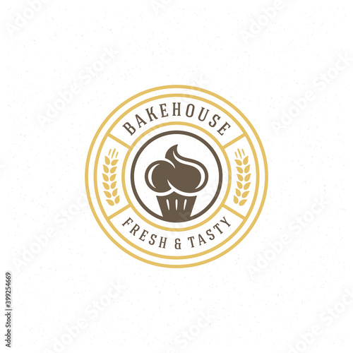 Bakery badge or label retro vector illustration cupcake and wheat silhouettes for bakehouse.