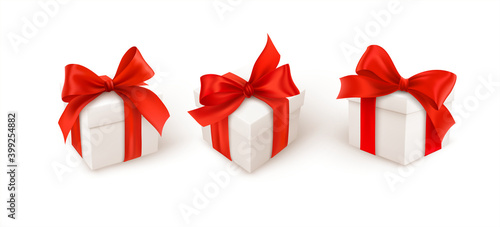 Set of three white gift boxes with red silk ribbon bow isolated on white background. Vector illustration