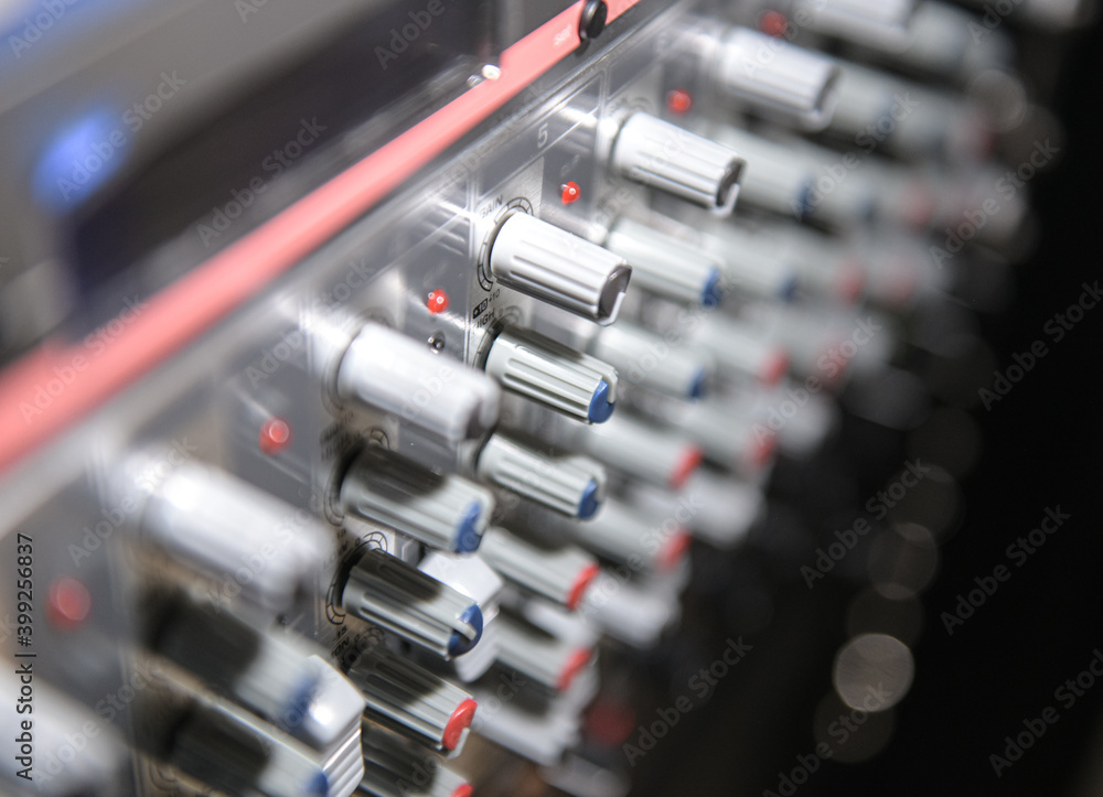Close up view of the buttons of a sound mixer Close up view of the buttons of a sound mixer